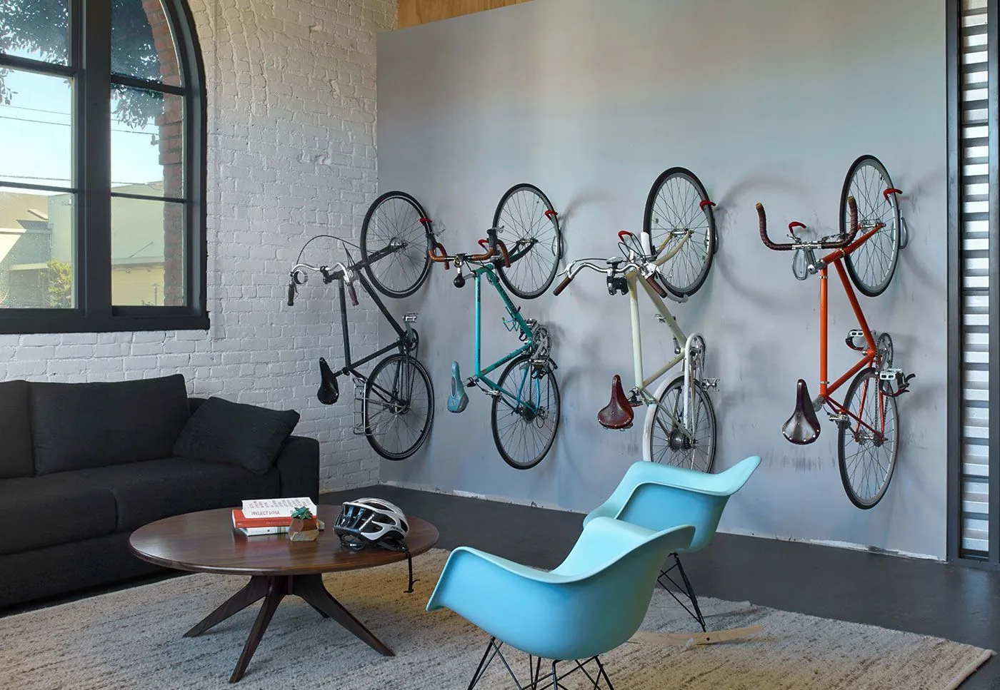 Brick-walled office lounge with bicycles hung on the wall
