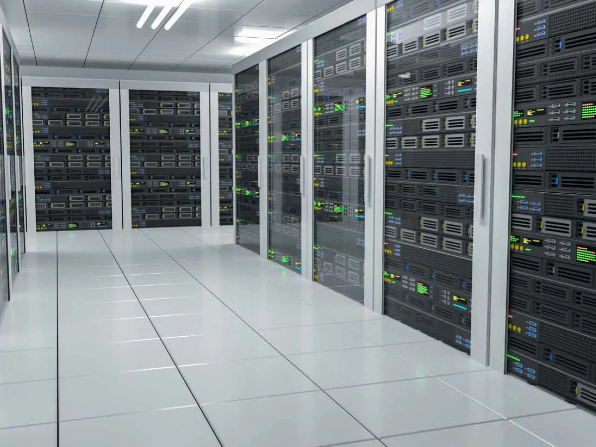Data centre aisle lined with server racks behind glass doors